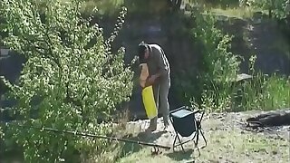 Horny bitch fucks a stranger at one's disposal the fishing lake